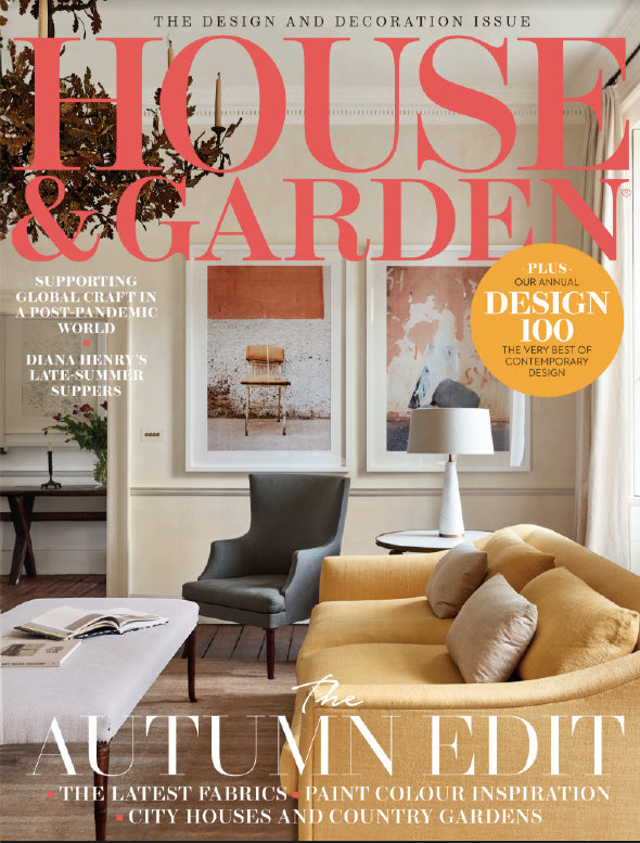 House & Garden magazine cover featuring a living room with a yellow sofa and gray chair.