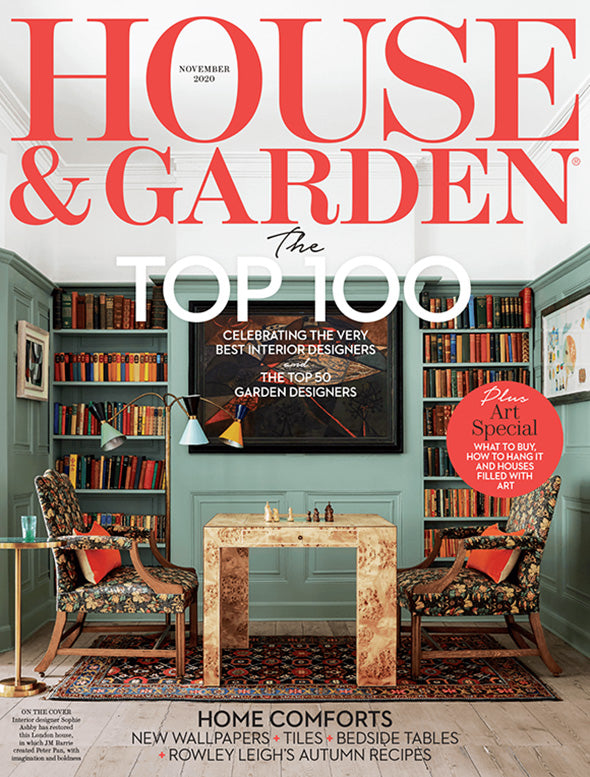 Cover of 'House & Garden' magazine featuring a room with bookshelves and a table.