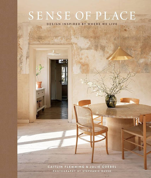 Book cover of 'Sense of Place' with a dining room scene and text about design inspired by where we live.
