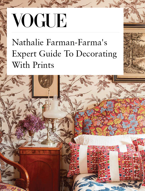 Decorative interior with floral wallpaper and colorful furniture, featuring Vogue magazine story about Décors Barbares.