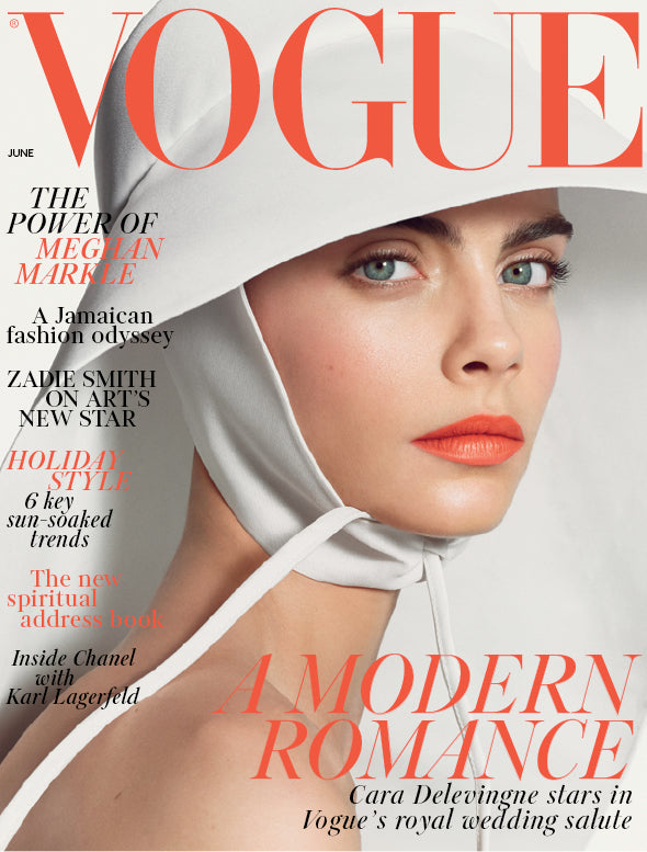 Vogue magazine cover featuring Cara Delevingne wearing a white headscarf 