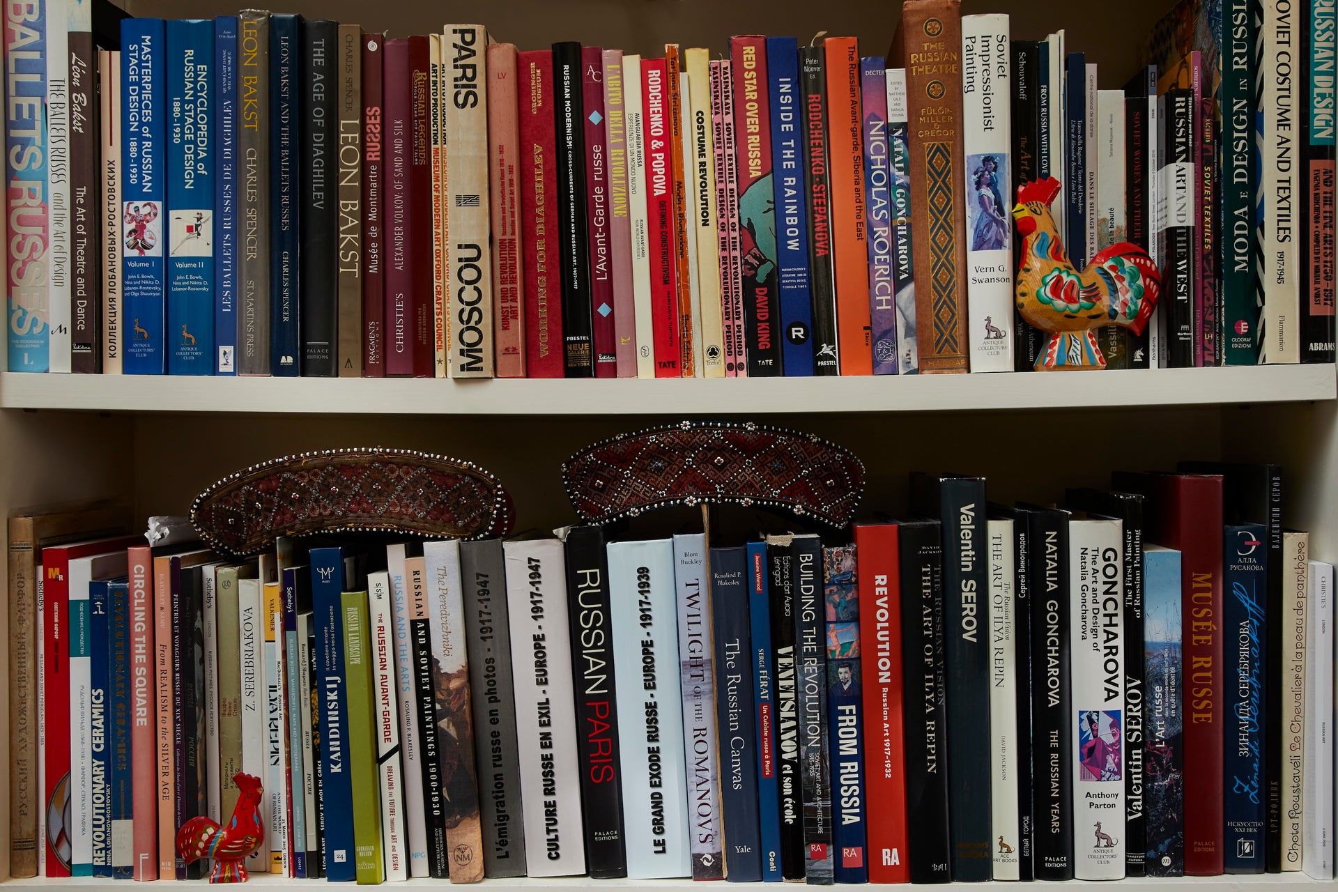 Bookshelf with a collection of books and decorative items.